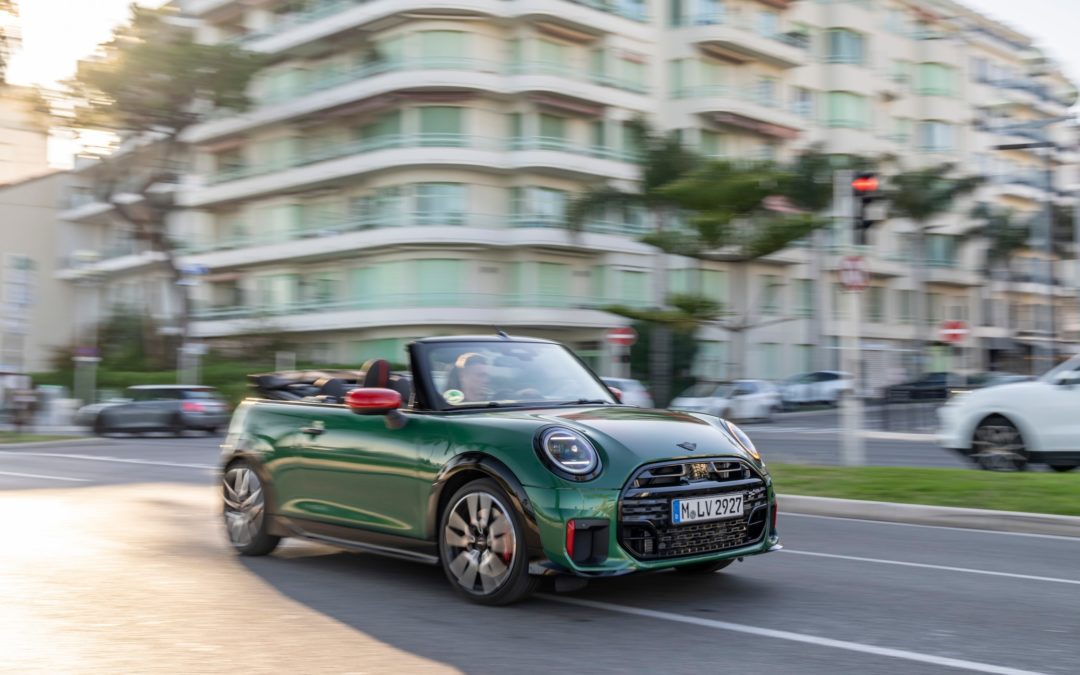 The MINI John Cooper Works Convertible: Top performance and 360 degrees of freedom under a blue sky.